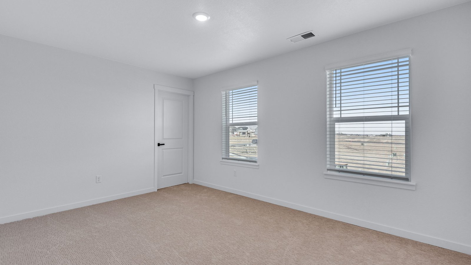 Guest bedroom in Bridgeport floor plan with comfortable space and neutral design.