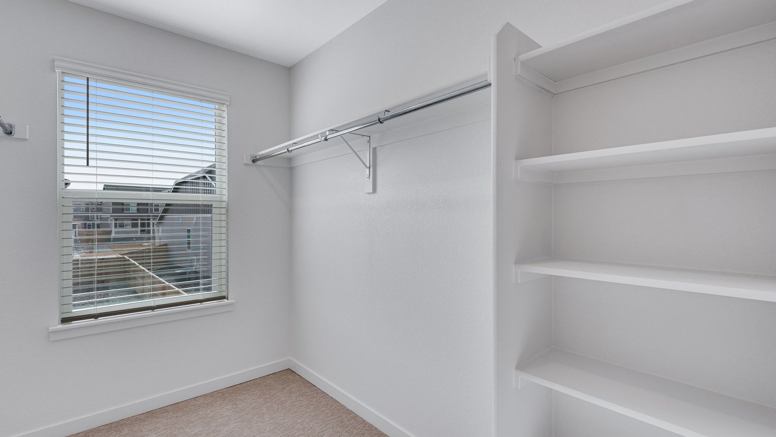 walk in closet in primary bedroom of new construction home parker, co