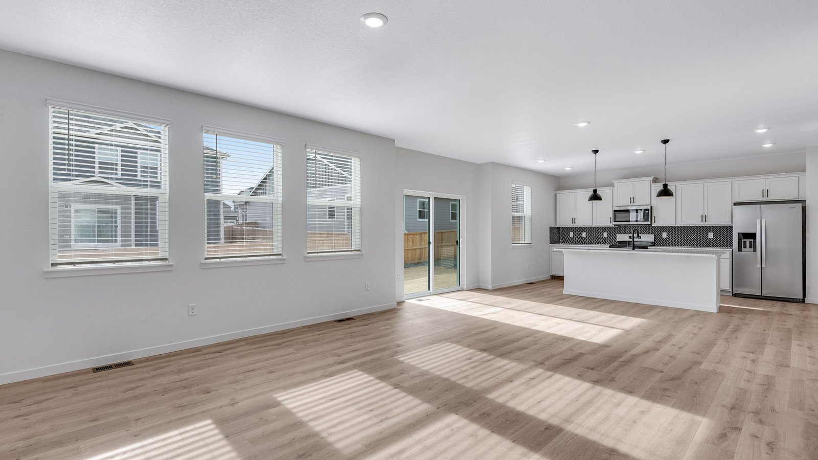 Light-filled living area perfect for entertaining, seamlessly connected to kitchen and dining.