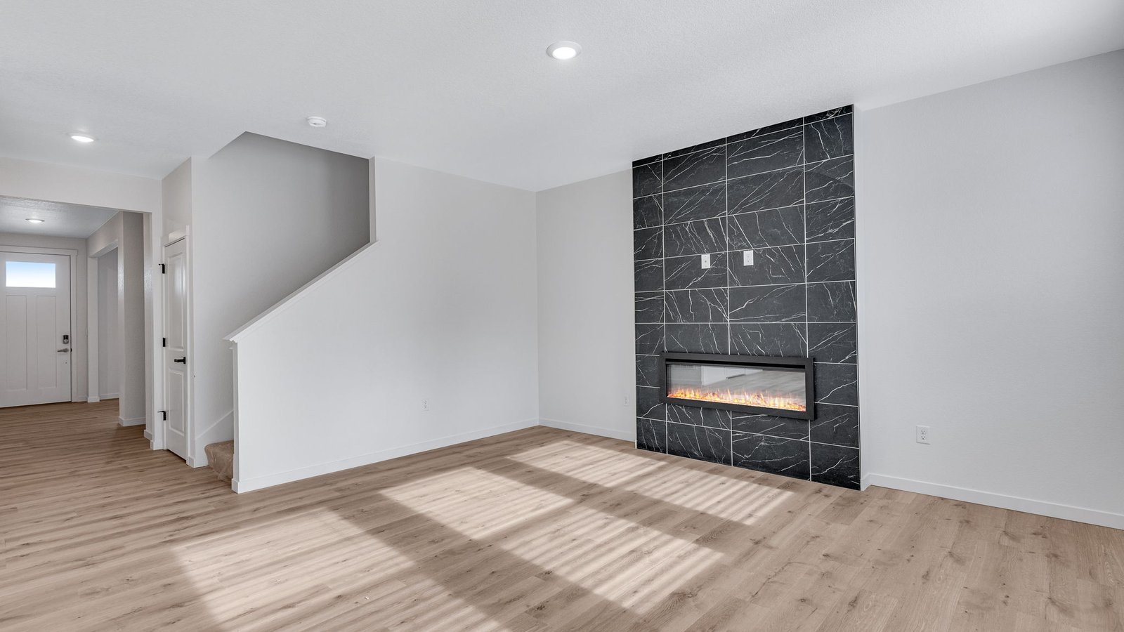 Modern living room with expansive layout and comfortable gathering space.