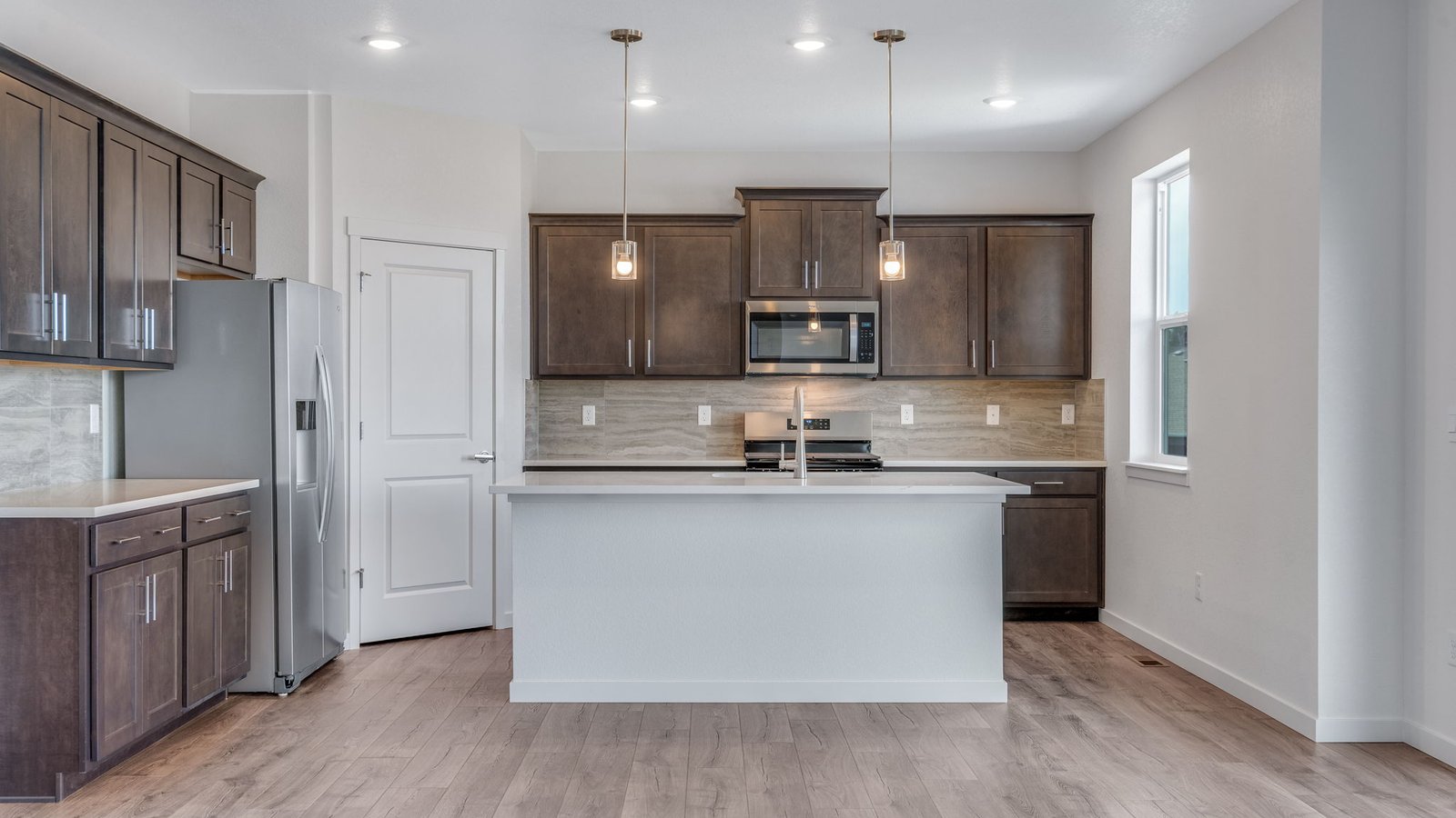 Spacious kitchen island perfect for entertaining in new home at Trails at Crowfoot community