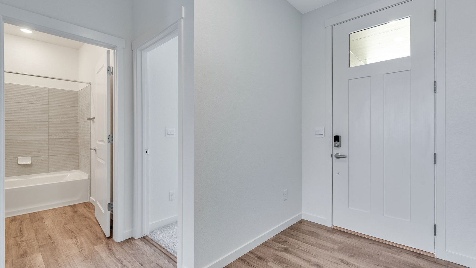 Trails at Crowfoot Hennessy home exterior featuring a welcoming entry and spacious driveway