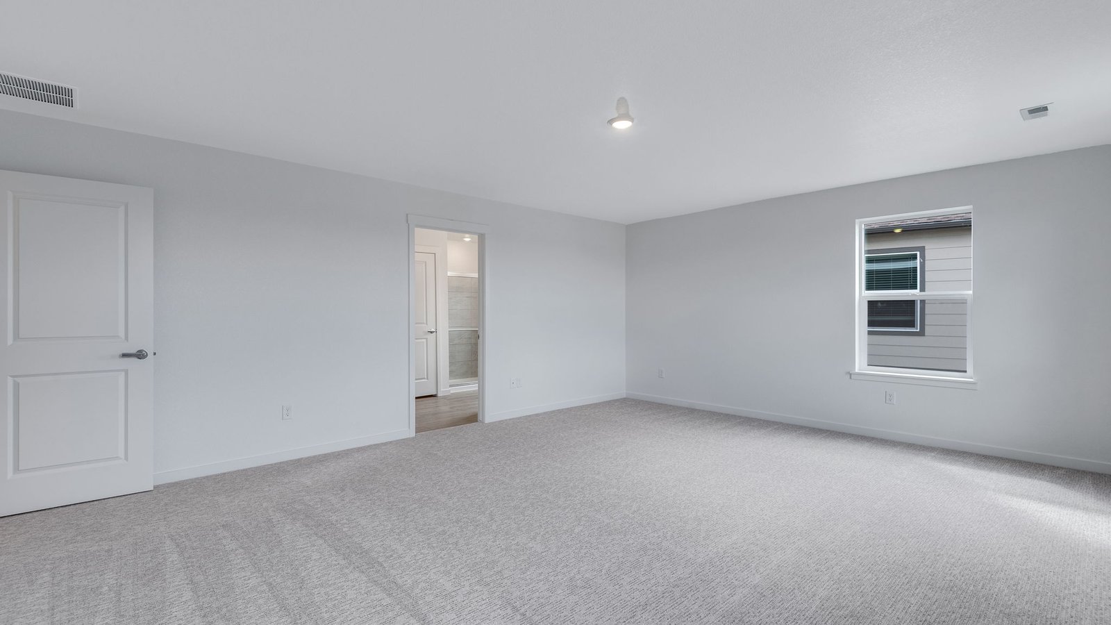 Primary bedroom in the Hennessy floor plan with generous space and natural light