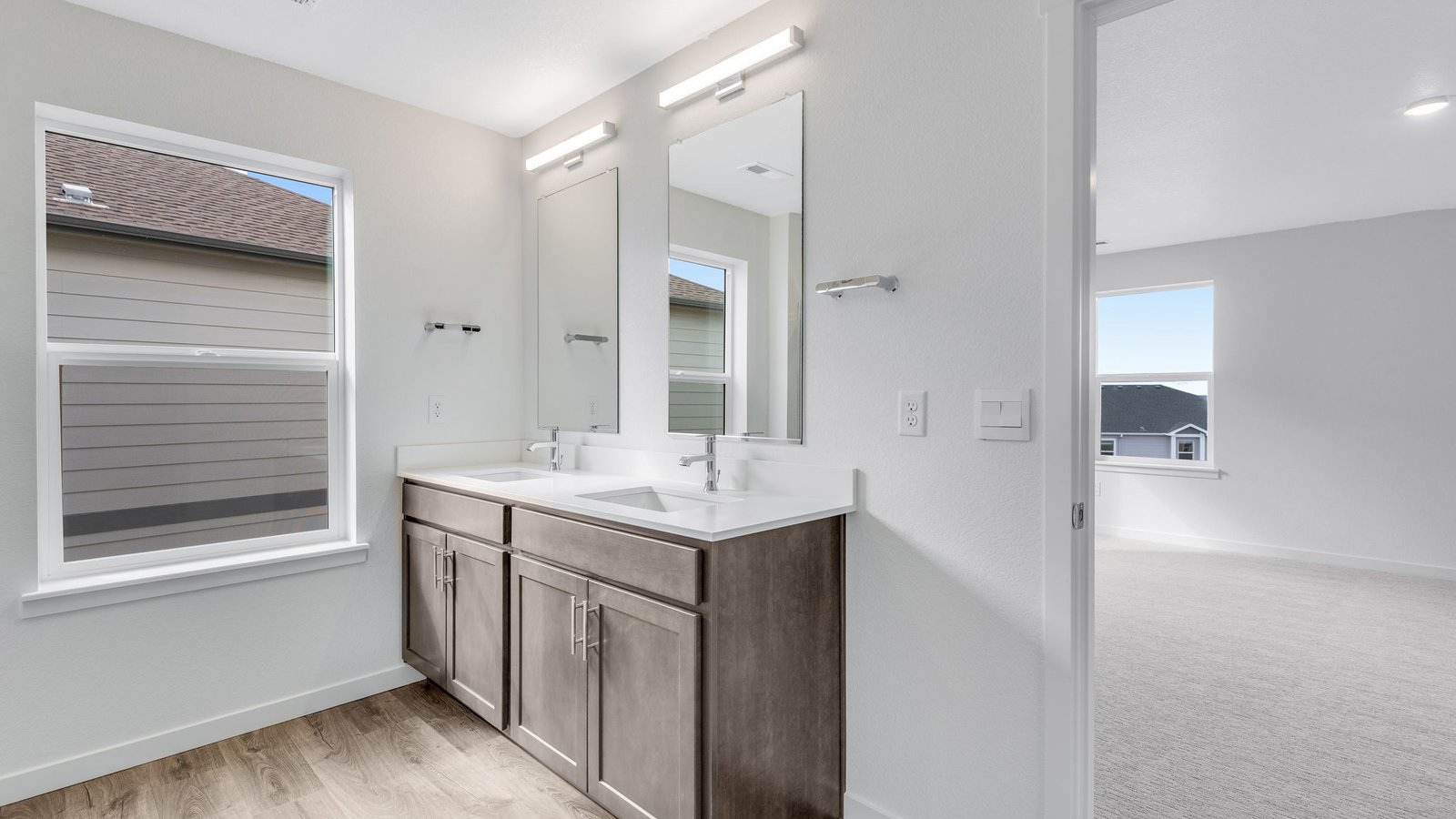 Owner’s bath featuring ample counter space and stylish finishes