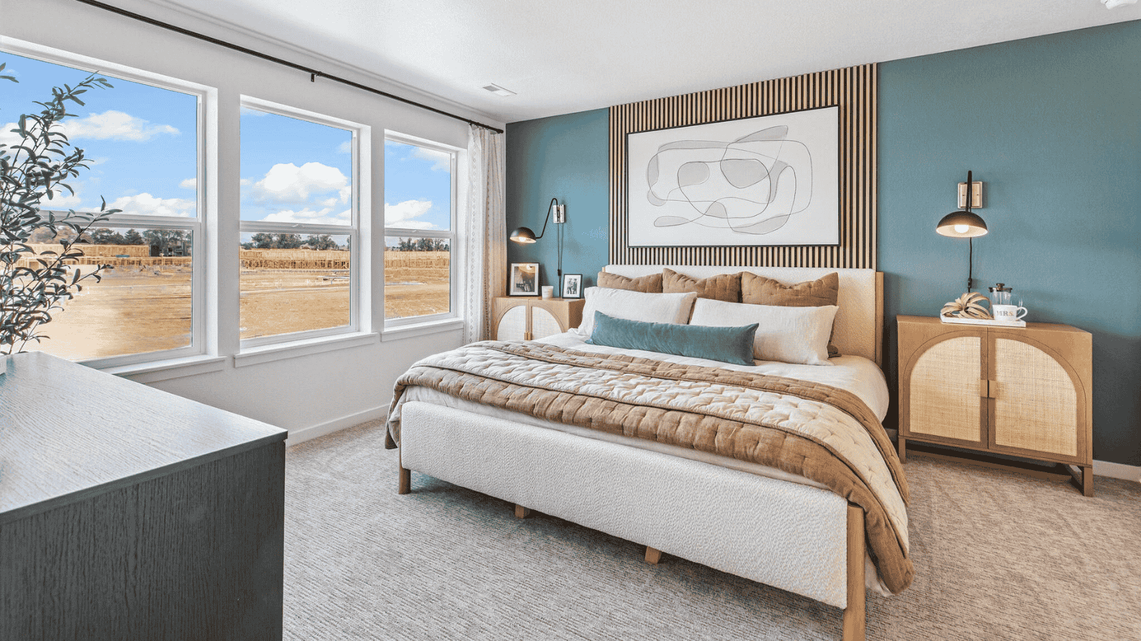 Spacious primary bedroom with large windows in new D.R. Horton home in Denver Colorado