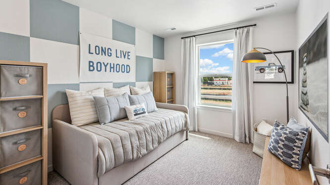 Furnished Muirfield model home secondary bedroom with 1 operable window.