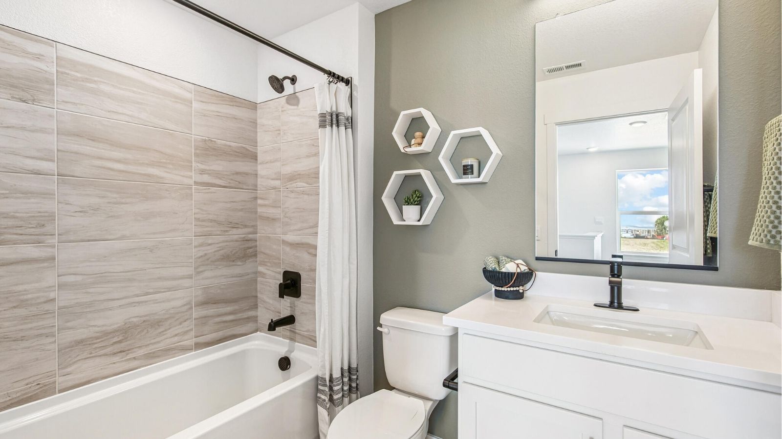 secondary bathroom with tub in new d.r. horton townhome Denver, CO