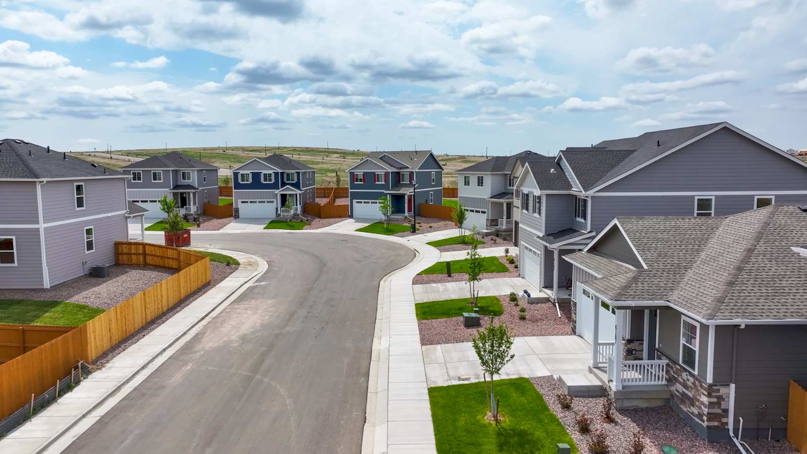 Street view of new homes in Lorson Ranch with landscaped front yards