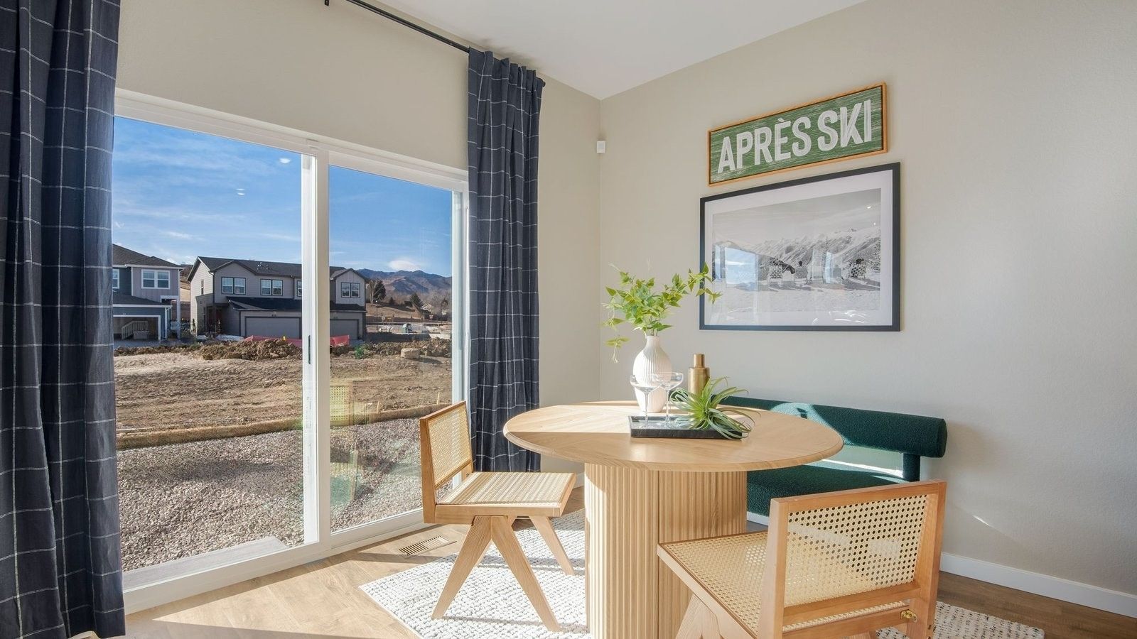Dining room with large windows in new D.R. Horton home at The Ridge at Lorson Ranch community