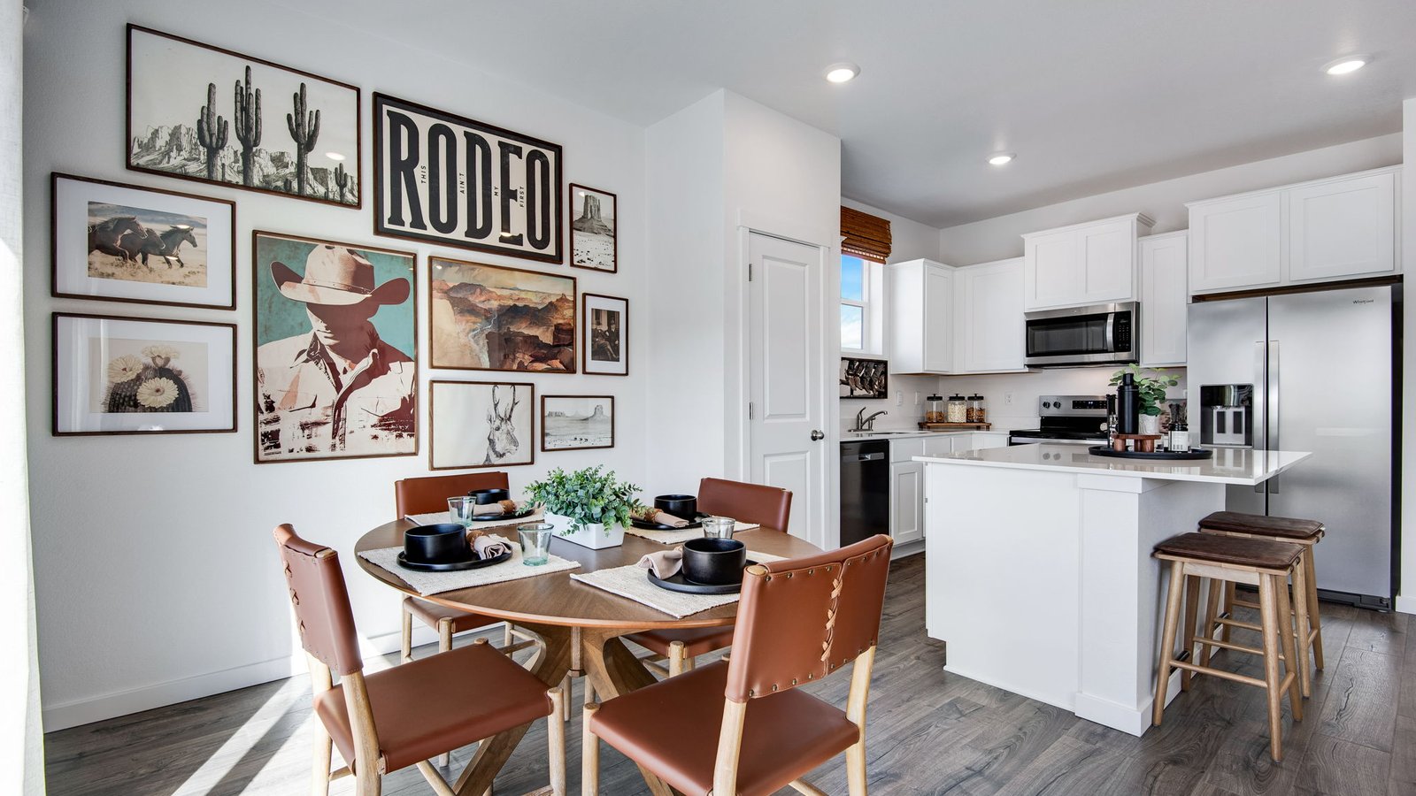 Bright dining area in the Osprey floor plan located off the kitchen and great room, ideal for entertaining and everyday living.