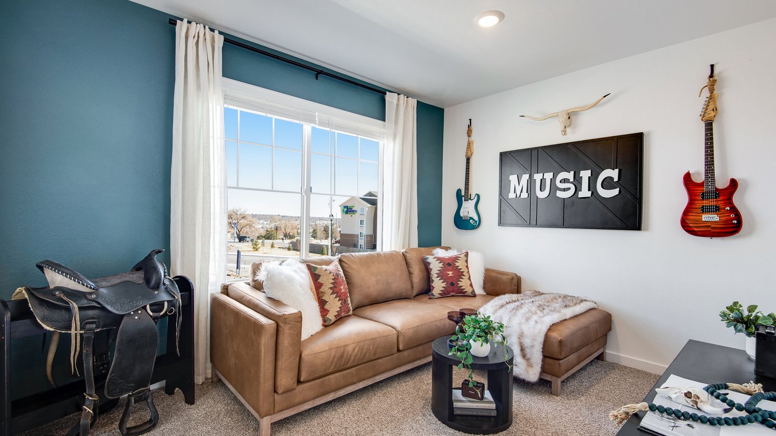 Versatile loft space in the Osprey floor plan ideal for a media room, office, or playroom.