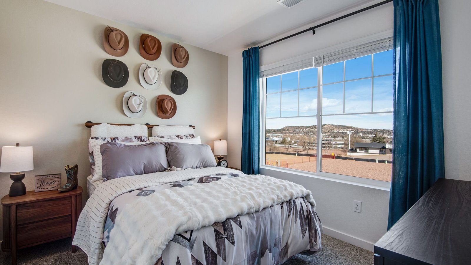 Secondary bedroom in the Osprey floor plan with ample closet space and flexibility for family, guests, or a home office.