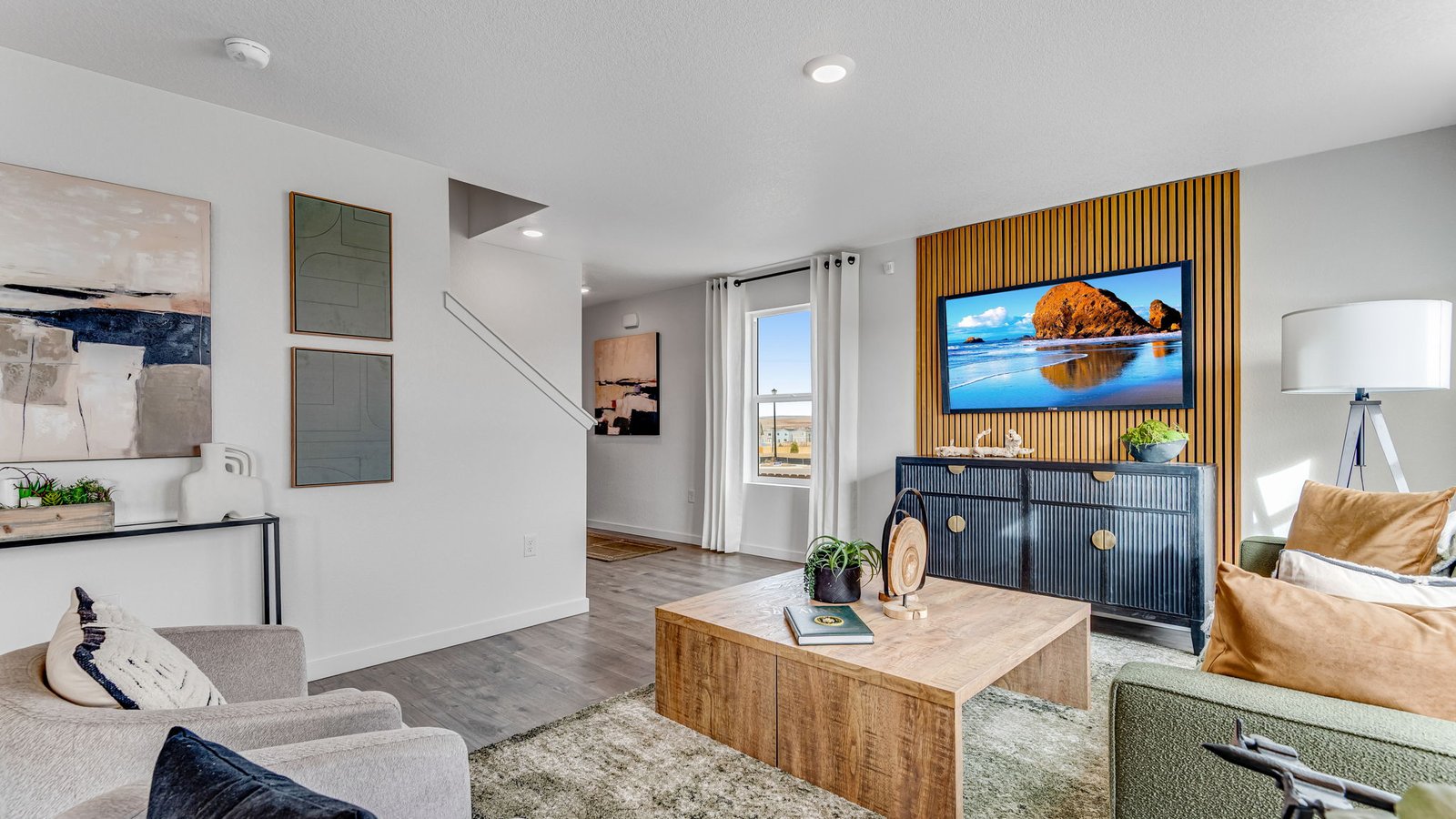 Bright living area with modern finishes and seamless connection to the kitchen and dining space.
