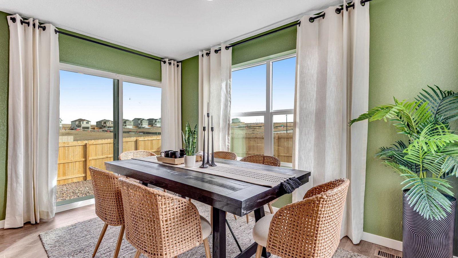 Dining area adjacent to the kitchen with open sightlines and natural light.