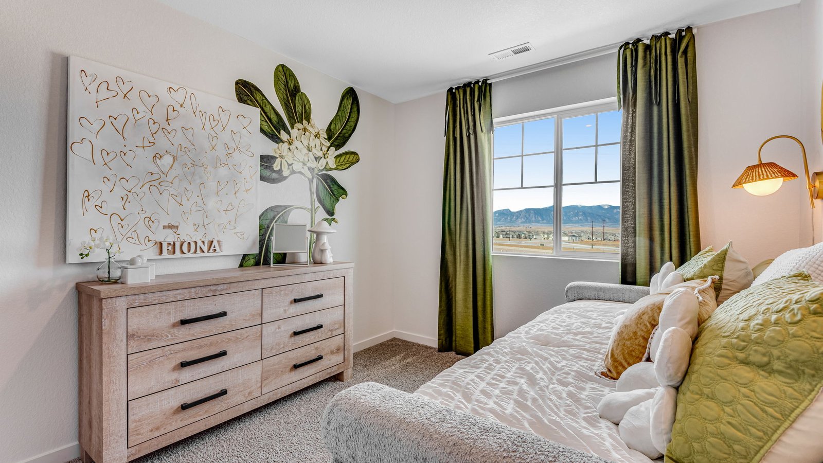 Comfortable bedroom with closet storage and bright windows.