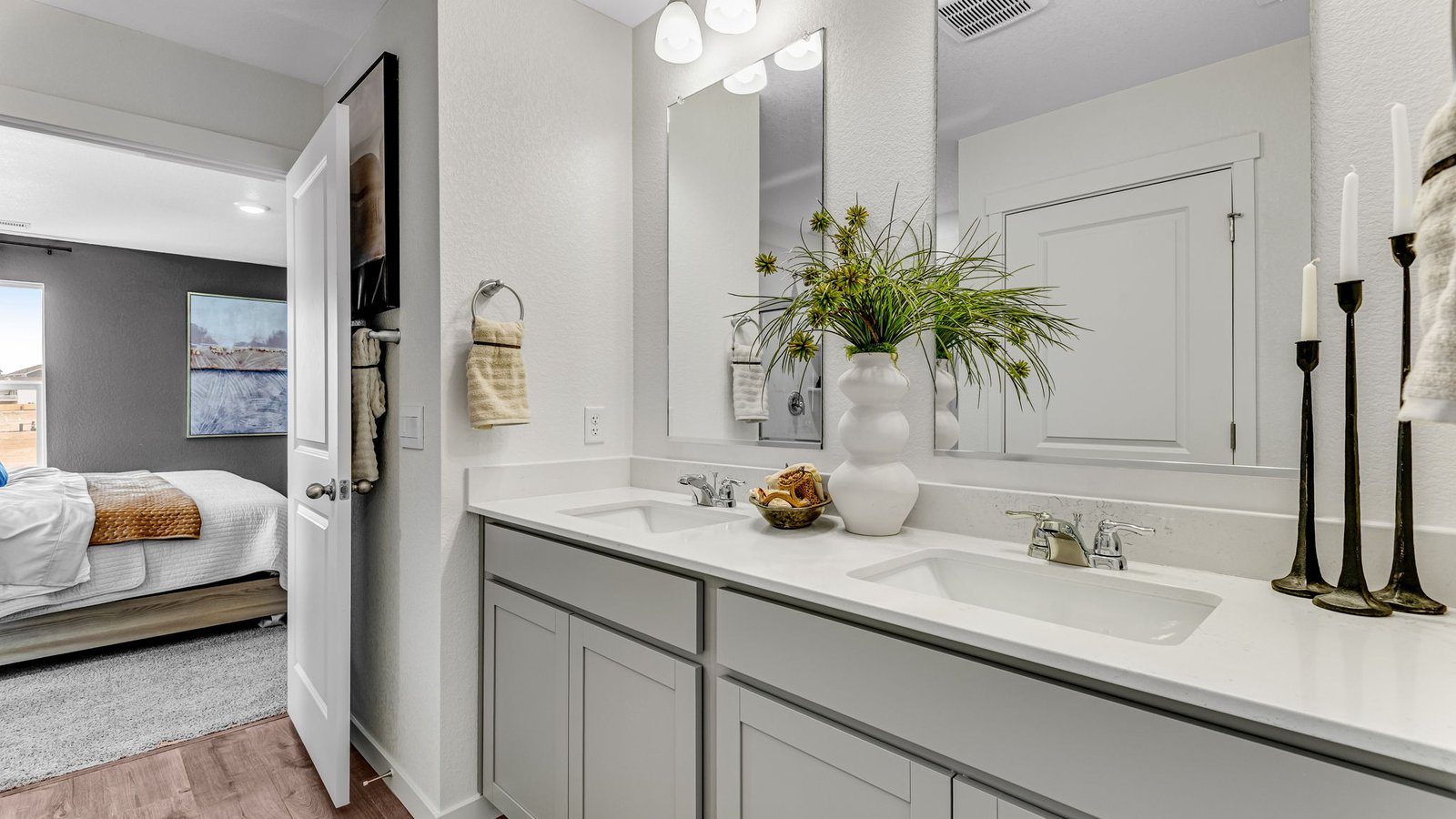 Owner’s bath featuring bright lighting and contemporary design details.