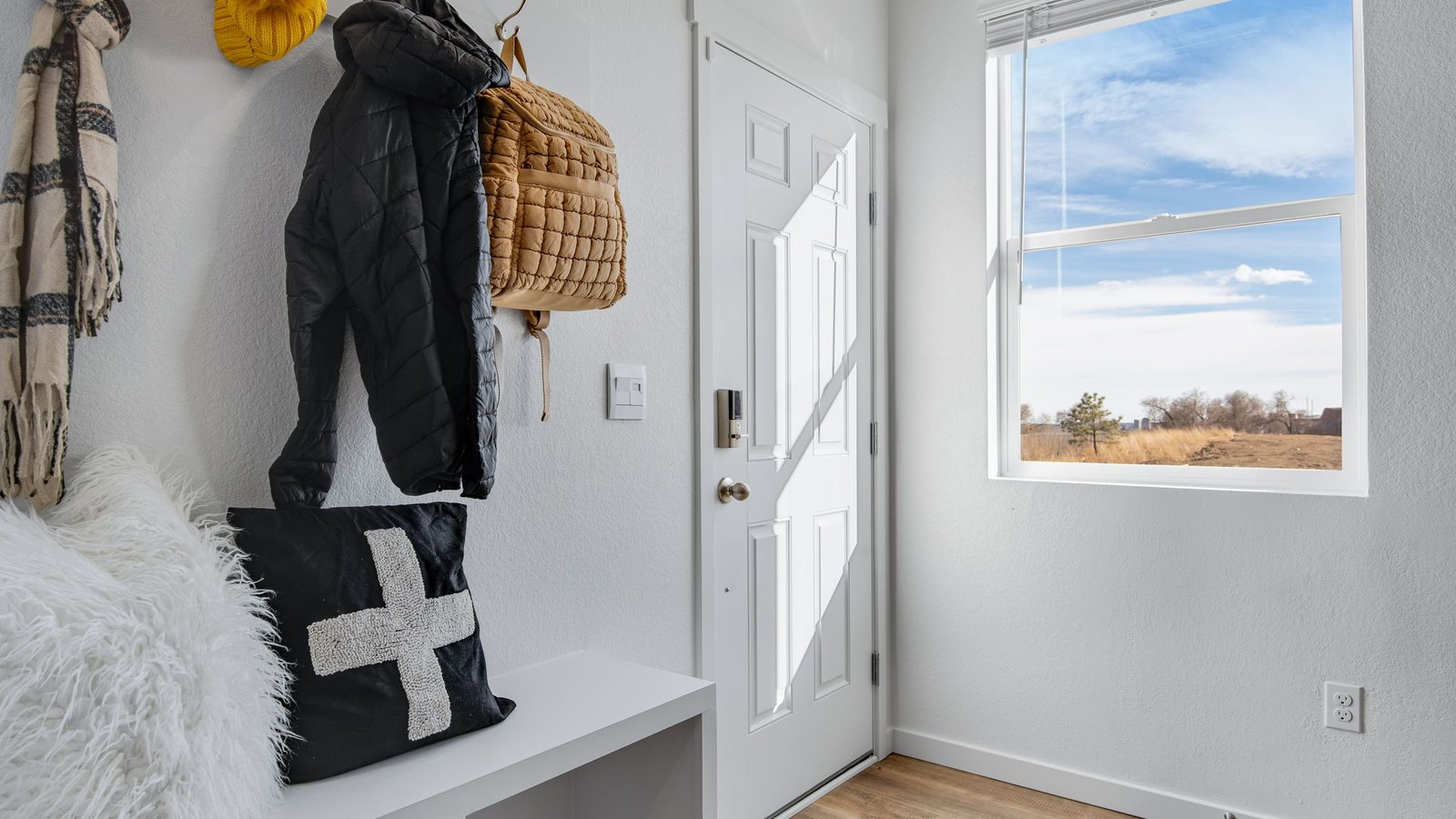 new model home entry with large window by d.r. horton colorado
