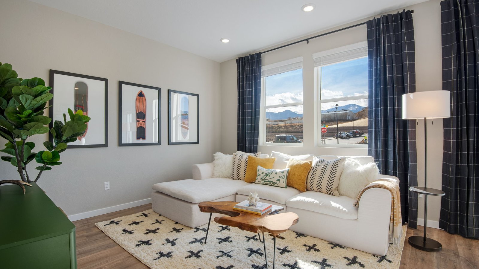Spacious living room with large windows in new D.R. Horton home in Colorado Springs