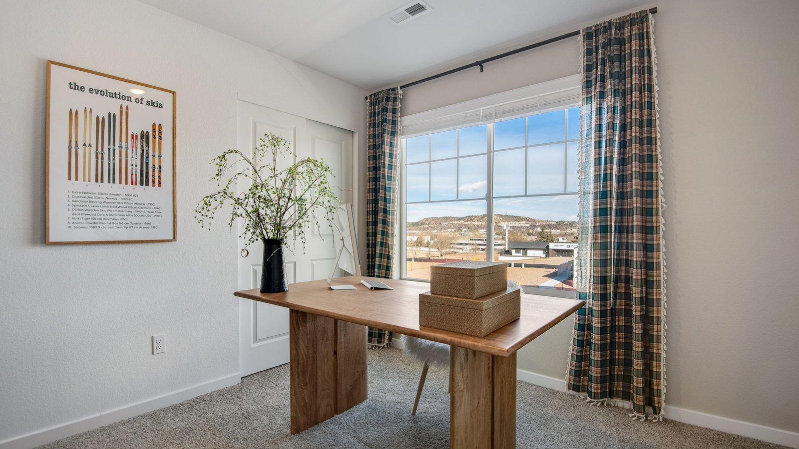 Secondary bedroom with large windows in new D.R. Horton home in Colorado Springs