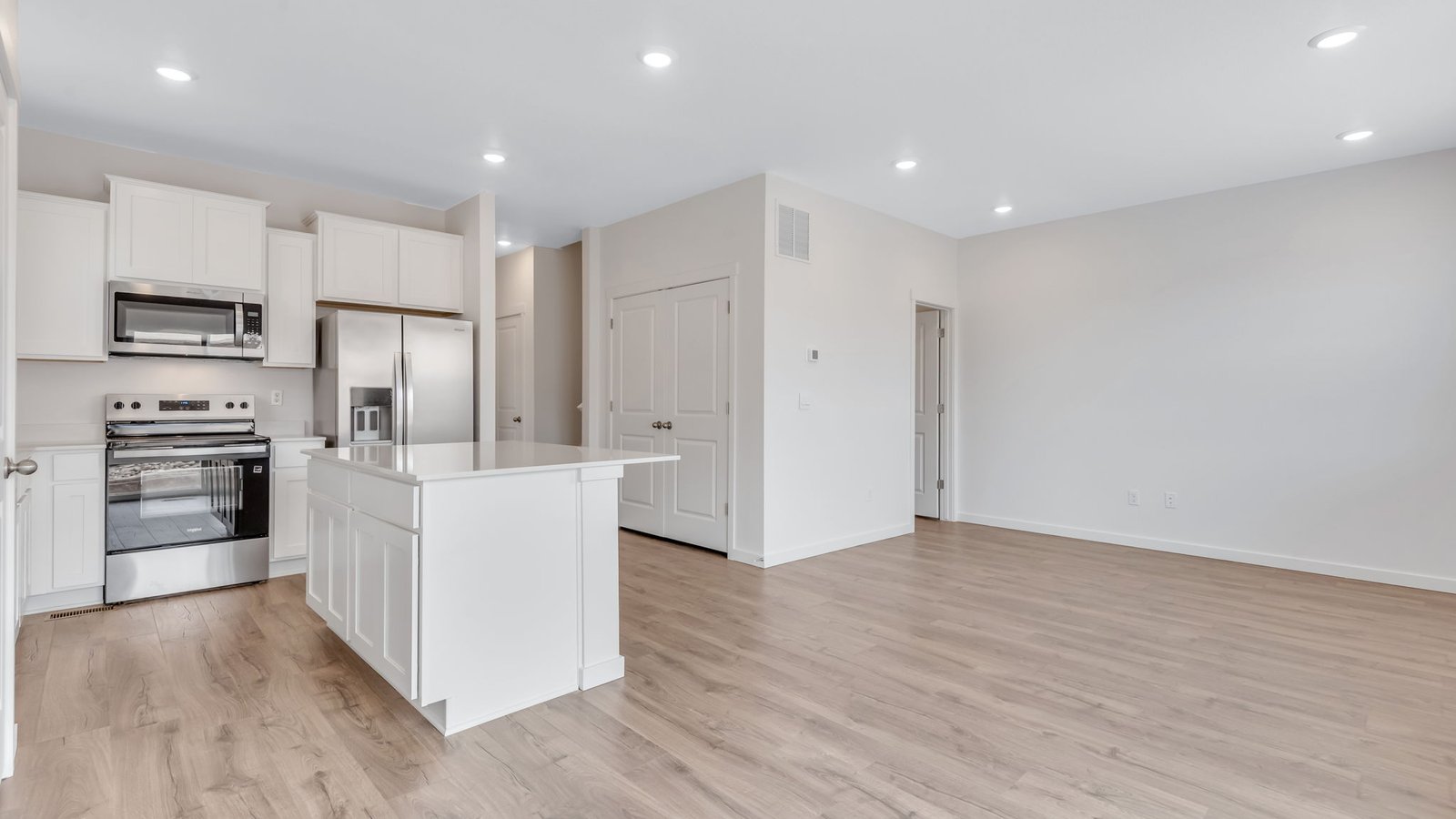 living area with open dining room