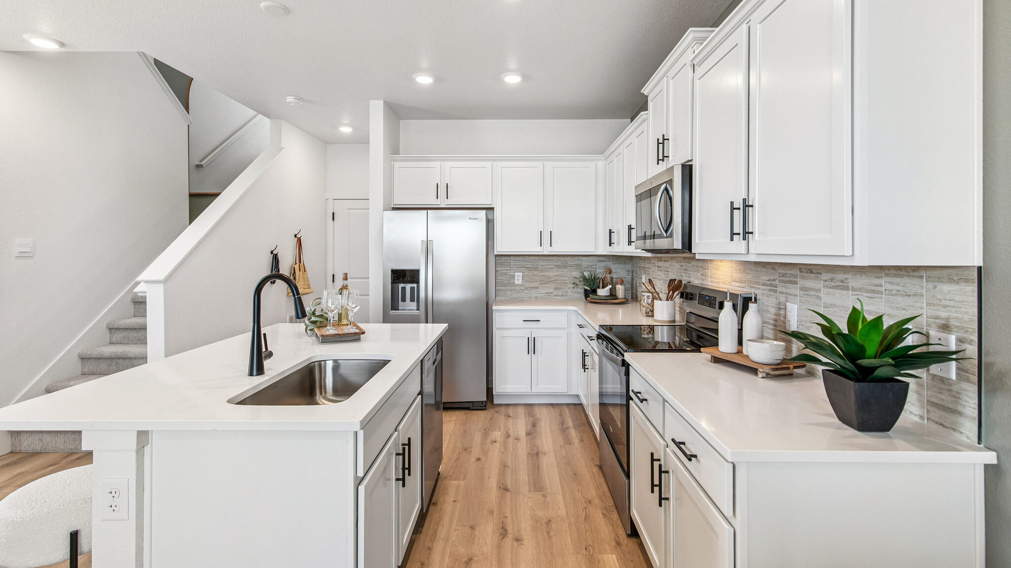modern kitchen with white cabinets in new home