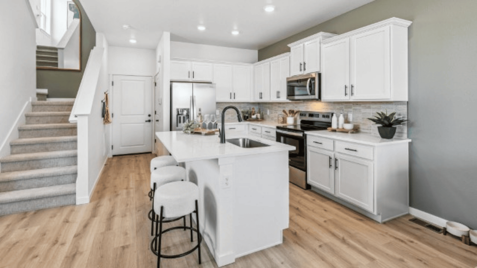 kitchen with kitchen island and white cabinets in new construction home