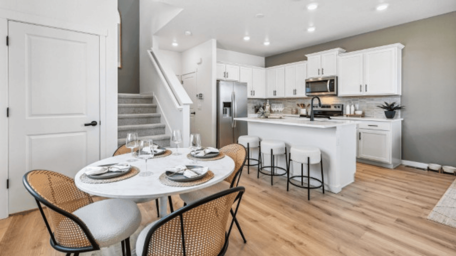 kitchen with white cabinets in new Settlers Crossing home by D.R. Horton in Commerce City, CO