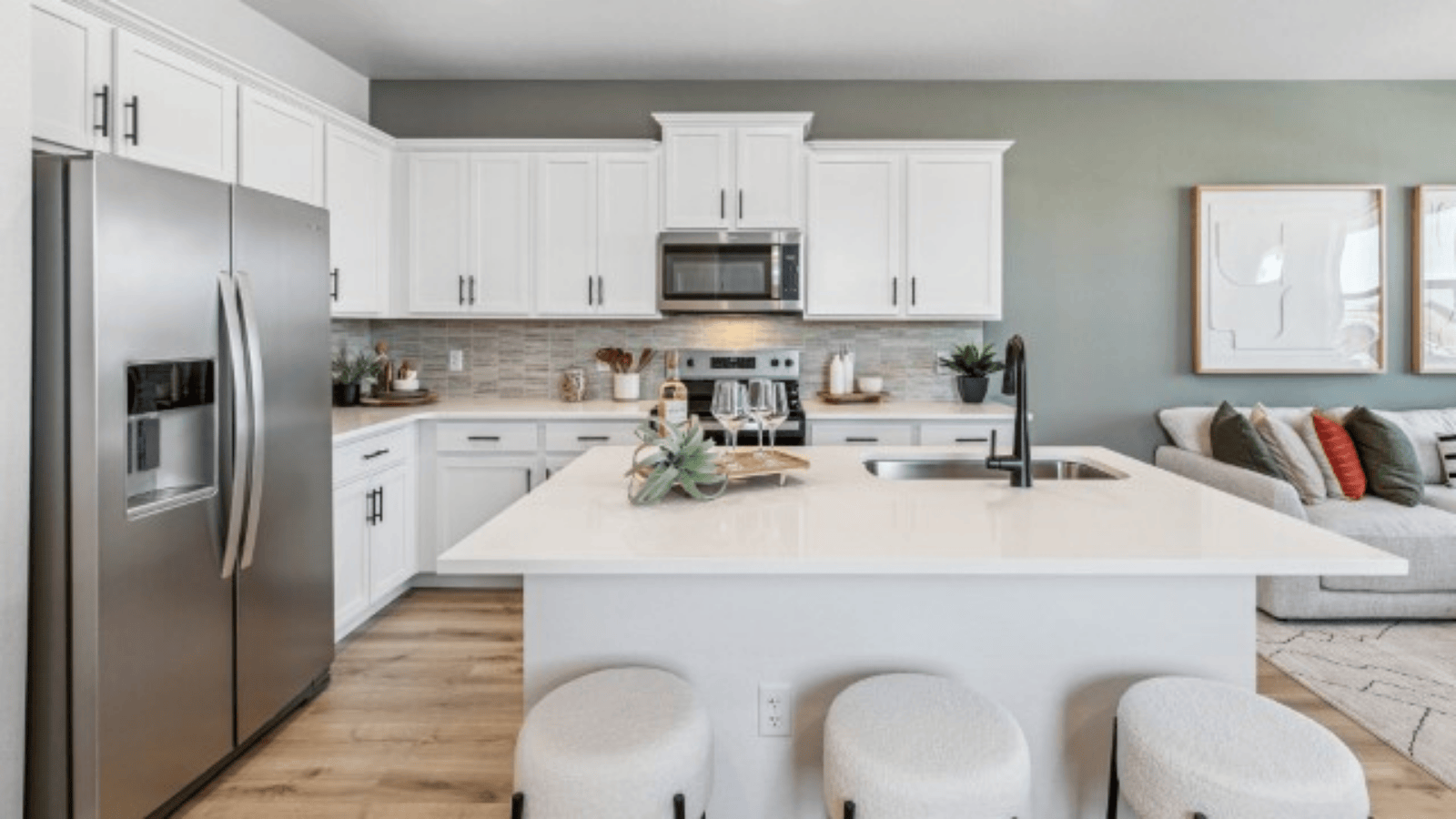 kitchen with white cabinets in new Settlers Crossing home by D.R. Horton in Commerce City, CO