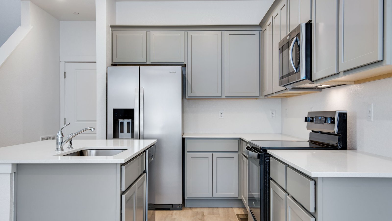 Spacious kitchen with new finishes at new home community in Commerce City Colorado