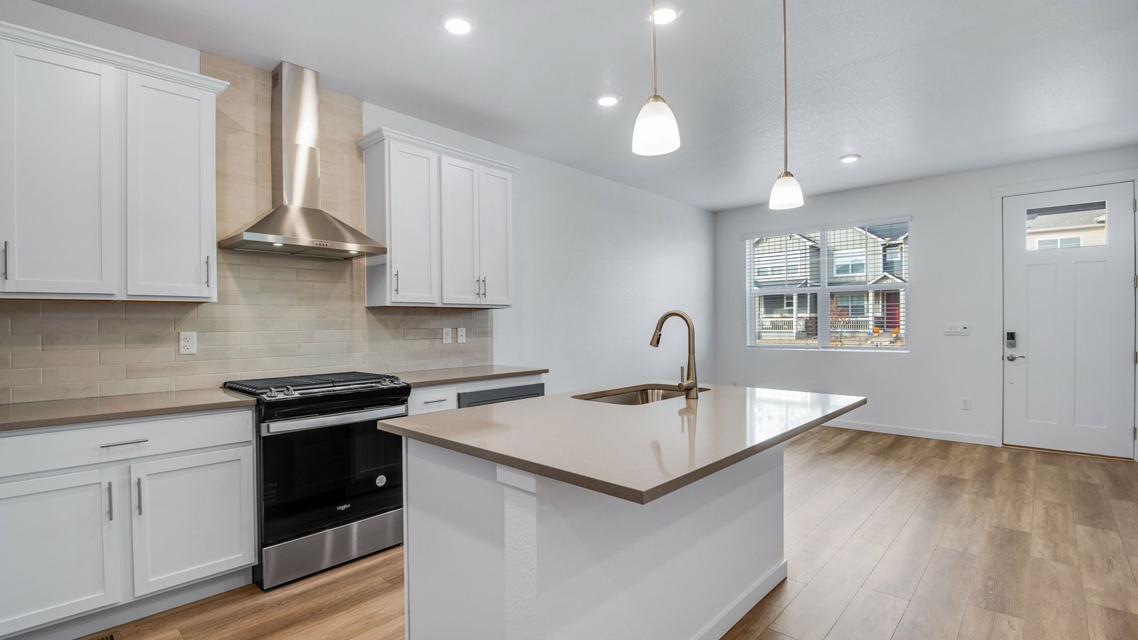 Spacious kitchen island in new home at Settler's Crossing community in Commerce City Colorado