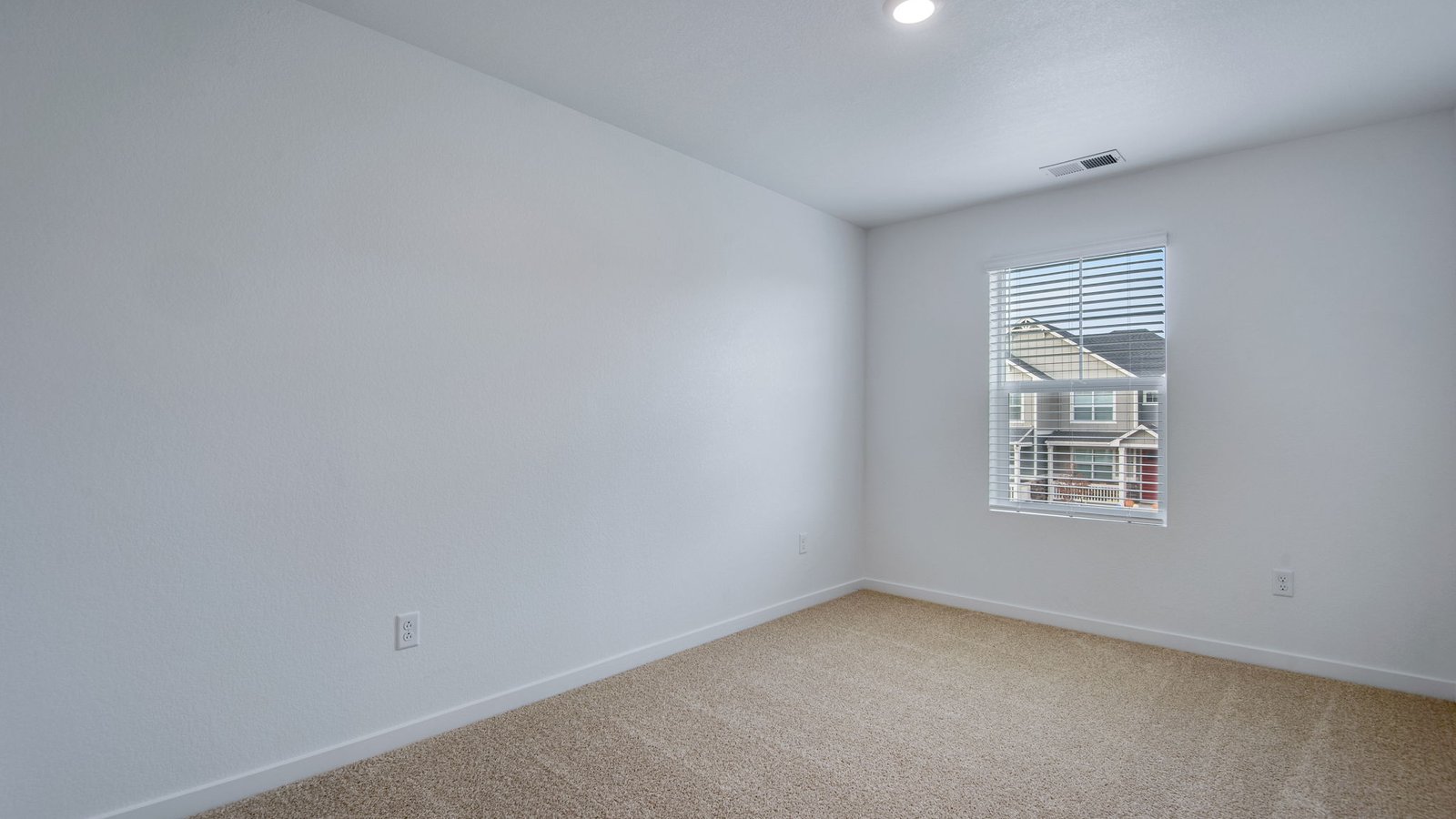 Secondary bedroom of new home in Commerce City Colorado
