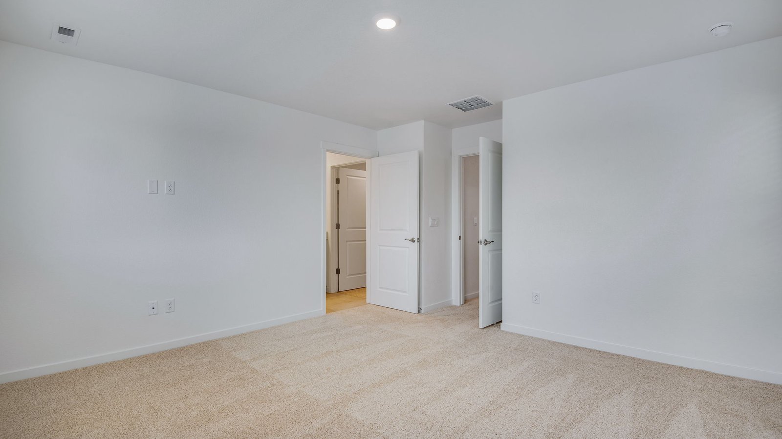 Spacious primary bedroom of new home in Commerce City Colorado