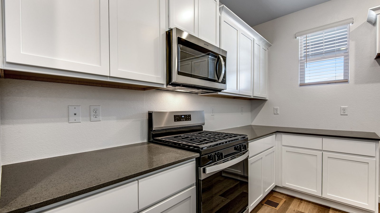 kitchen with white cabinets in new home