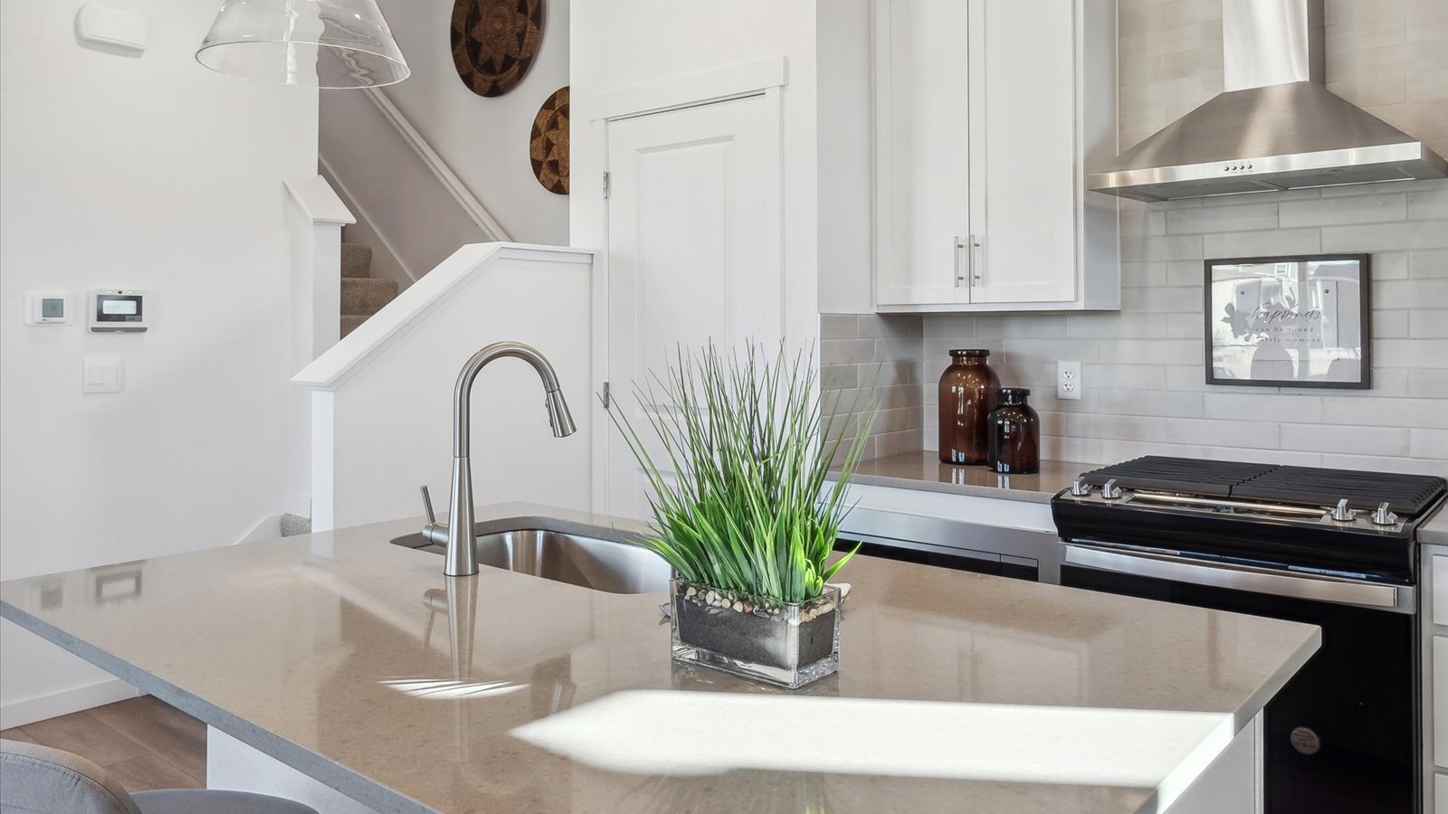 Modern kitchen with island in Settlers Crossing new home