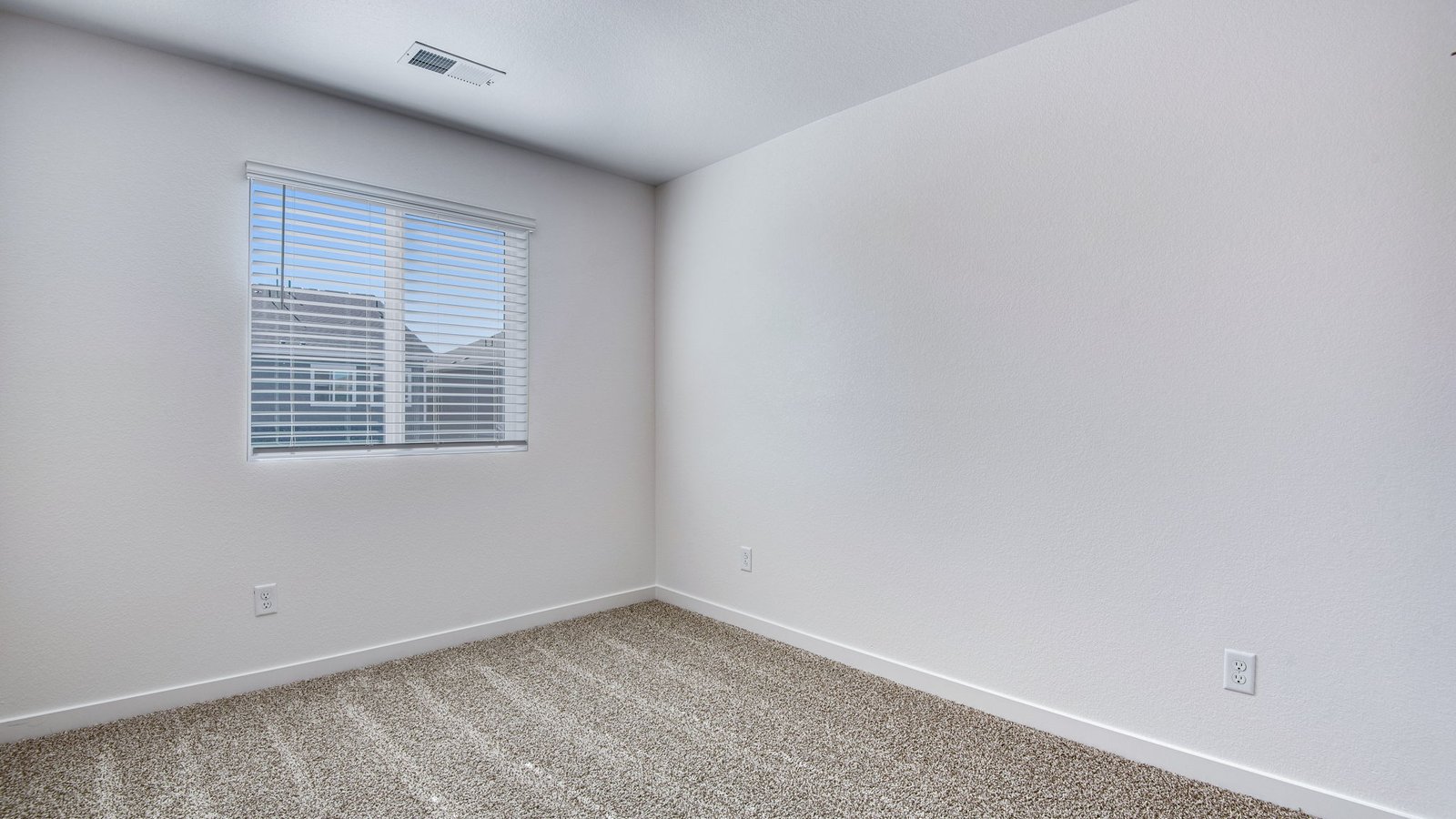 Light and airy bedroom in the Muirfield floor plan at Settlers Crossing.