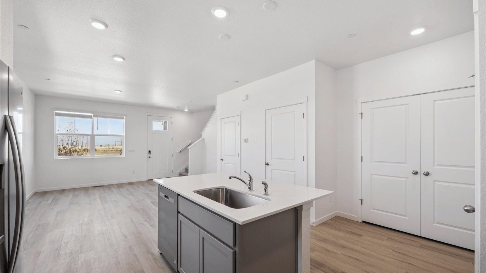 Kitchen with kitchen island in new paired home