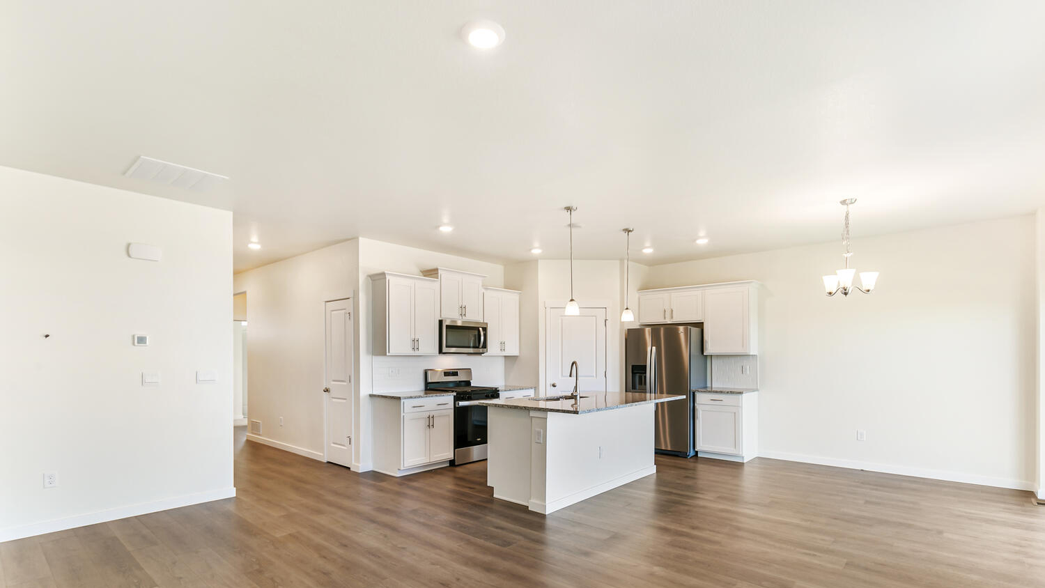 Corner view of kitchen with corner pantry and center island