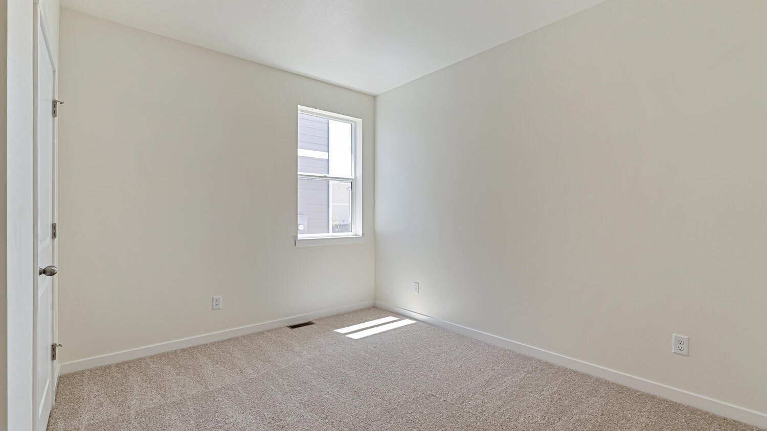 Another bedroom showing window, plush carpeting, and closet storage