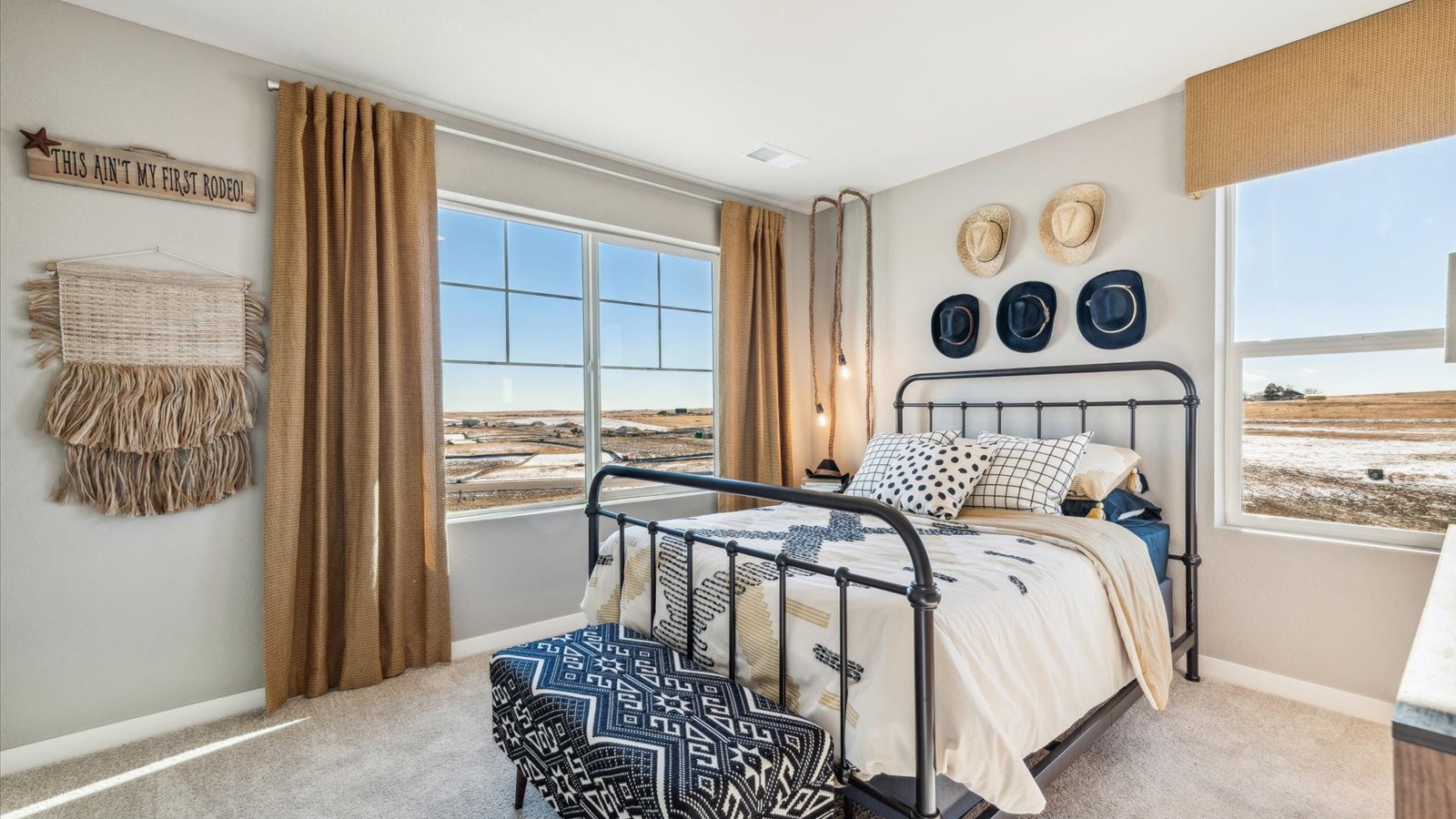 Secondary bedroom in new home at Settler's Crossing with large windows