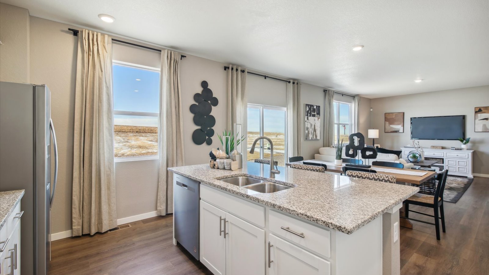 Spacious kitchen island perfect for entertaining in new home at Settler's Crossing community in commerce city