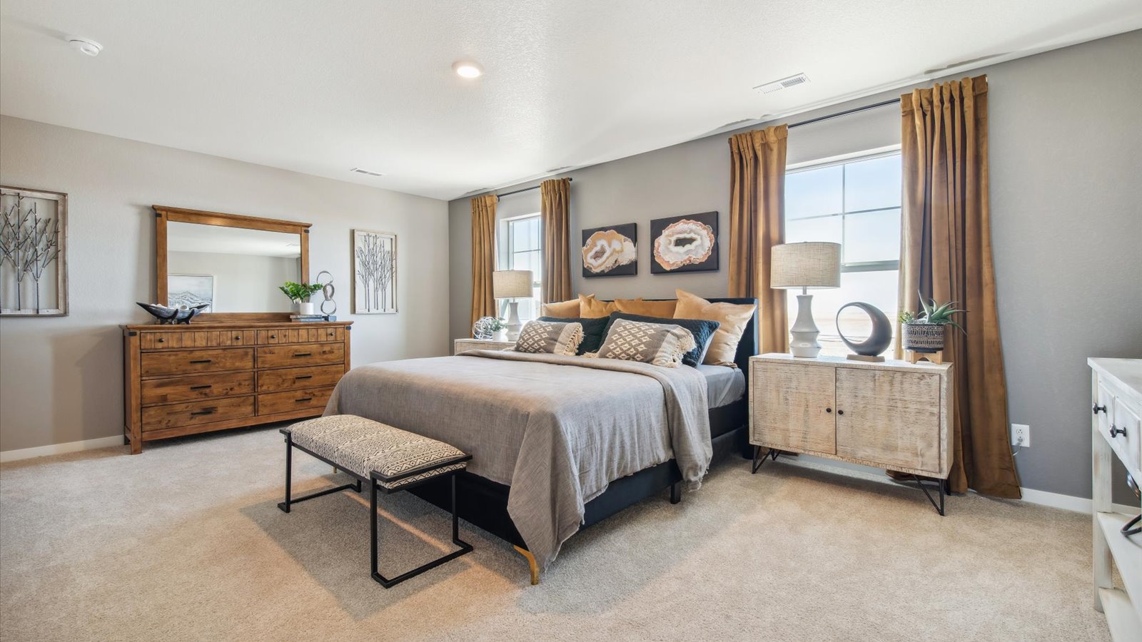 Spacious primary bedroom with large windows in D.R. Horton Pendleton floorplan