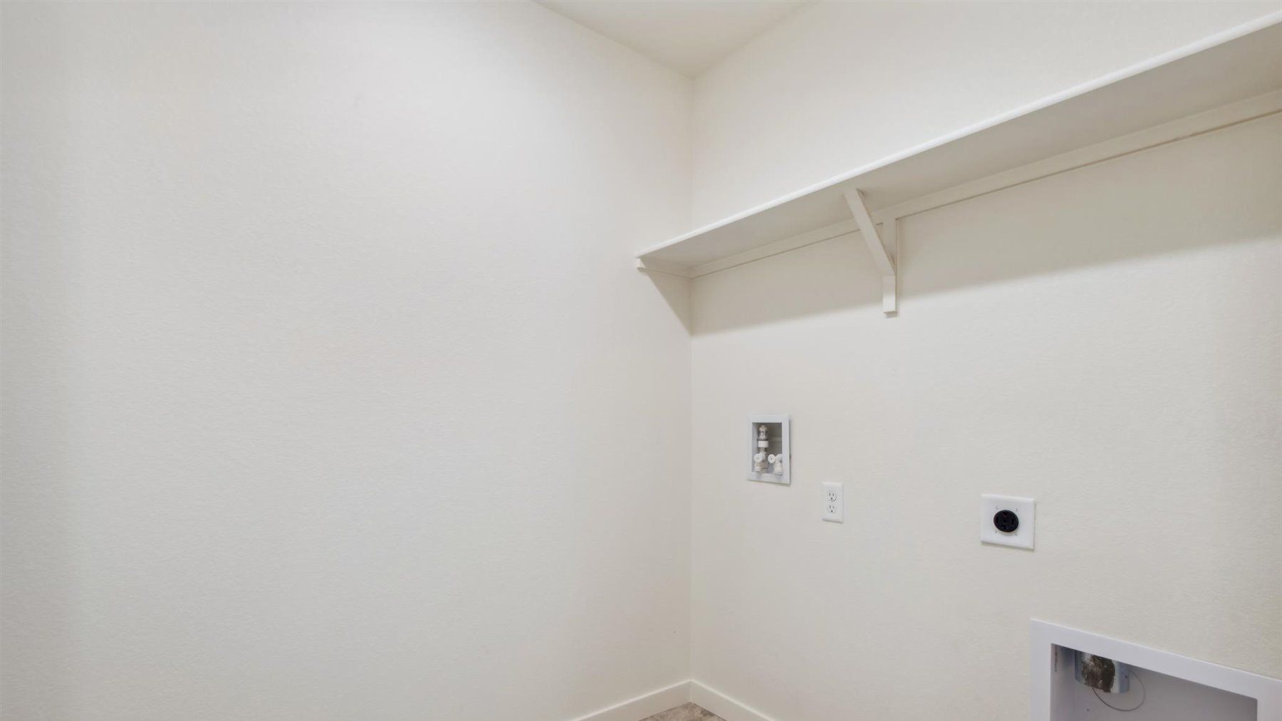 Laundry room near loft and additional bedroom with optional shelving and full washer/dryer hookups