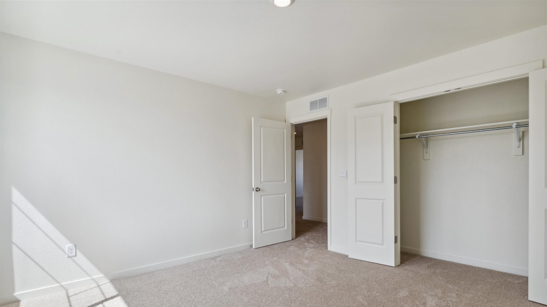 Alternate view of additional bedroom with LED lighting, plush carpeting, and large double door closet
