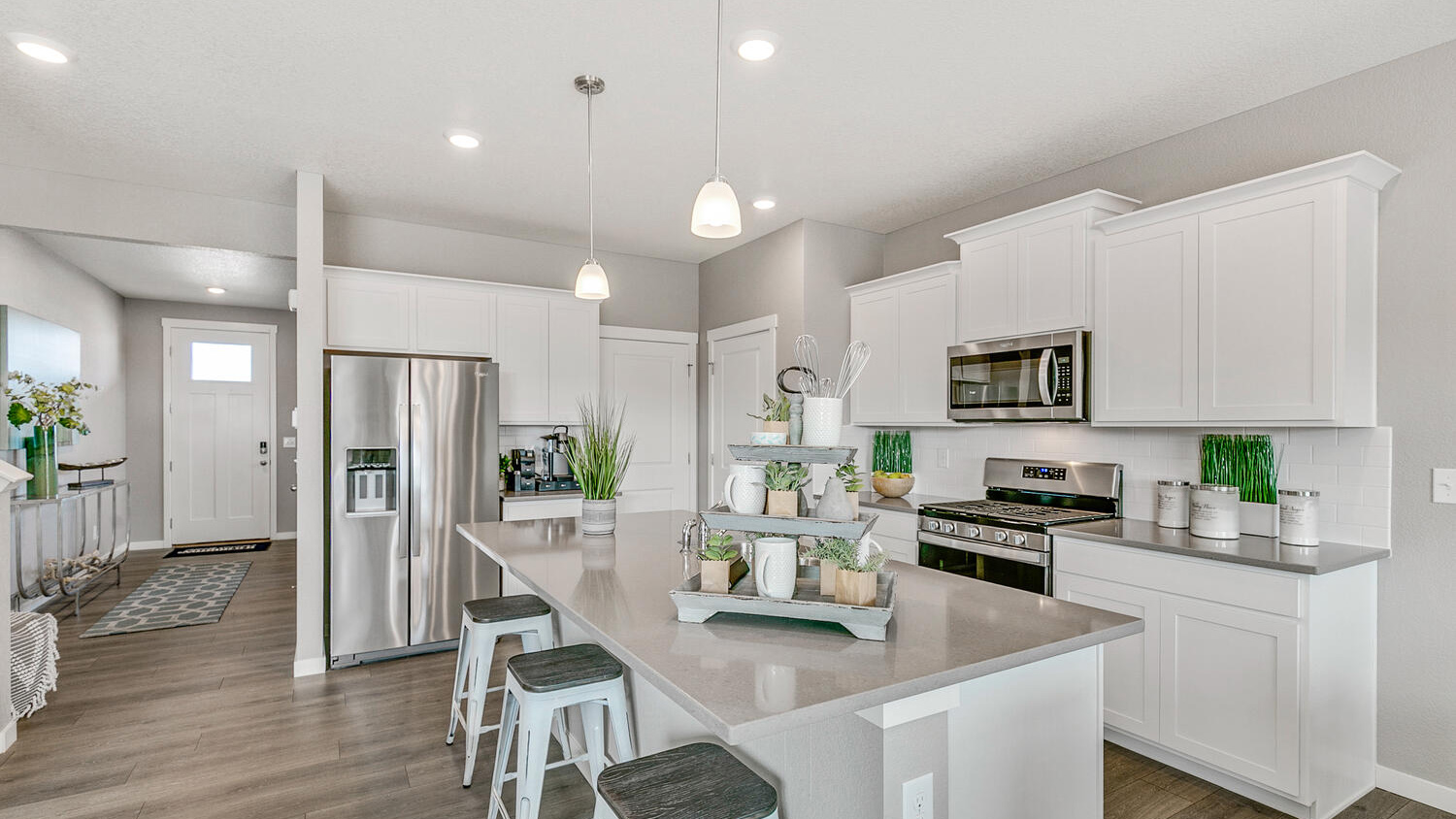 Spacious kitchen with new appliances at Settler's Crossing Community in Commerce City