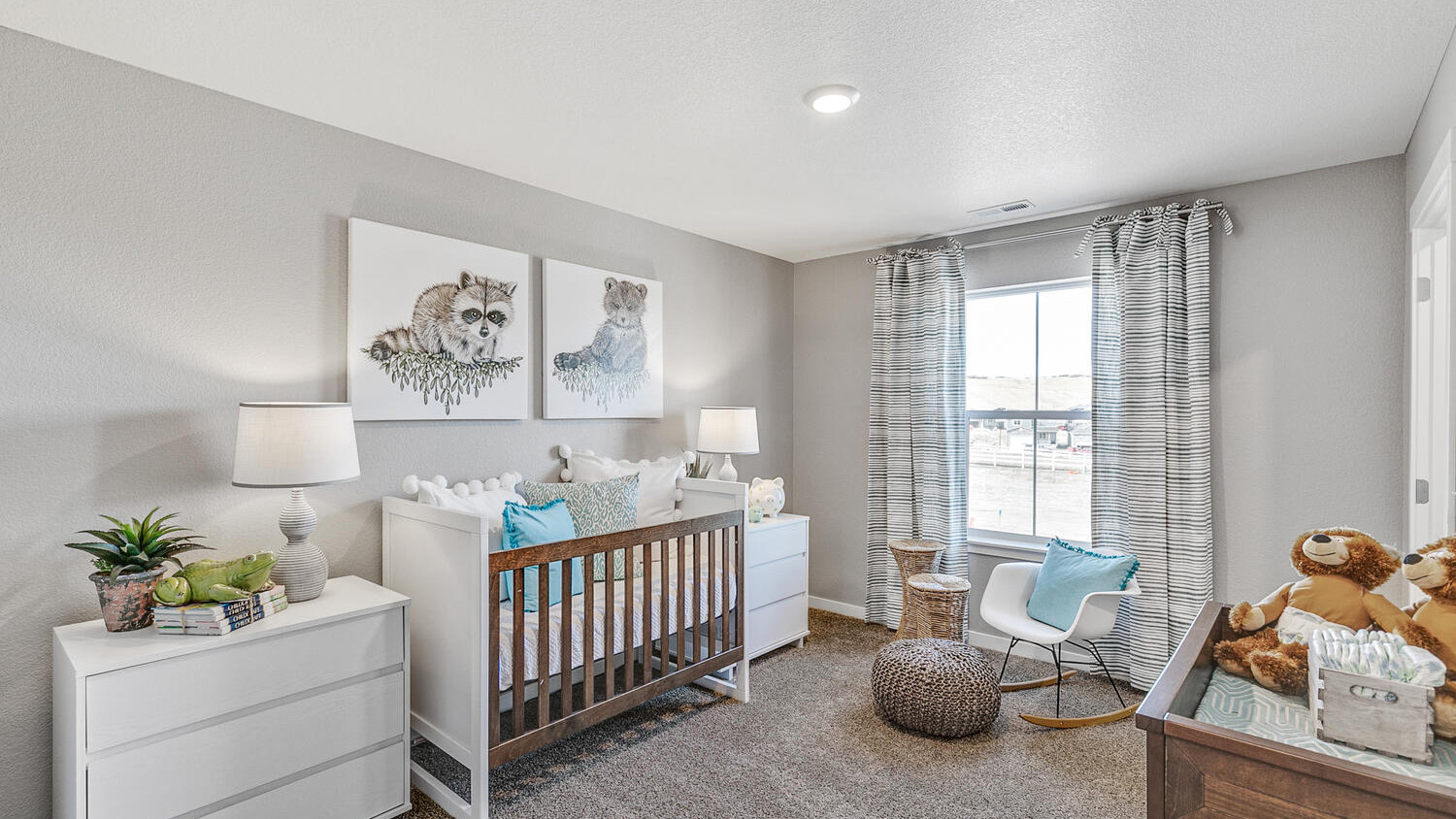 Secondary bedroom with large windows in new home at Settler's Crossing
