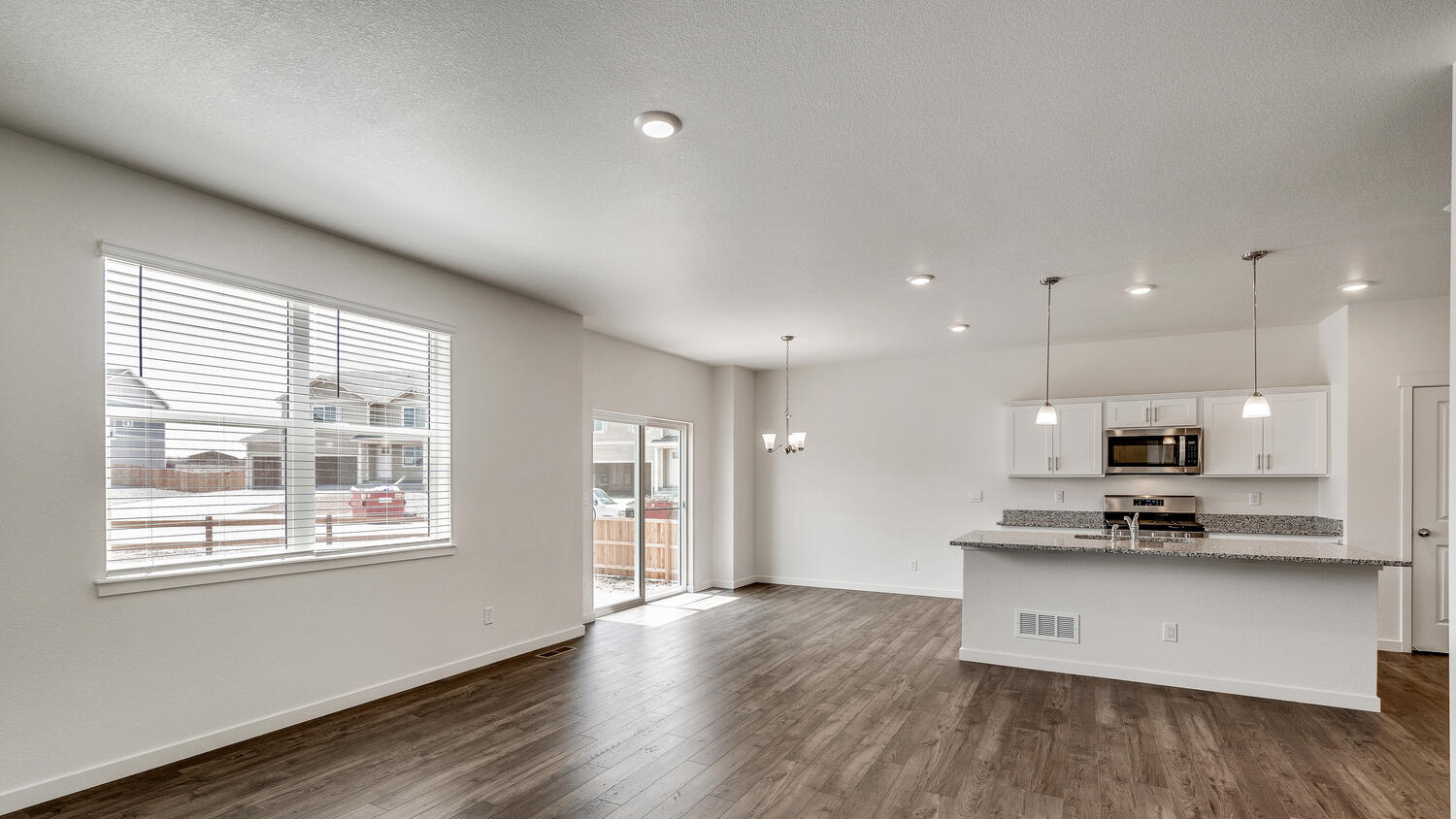 Open-concept floor plan showing connected kitchen, dining area, and great room