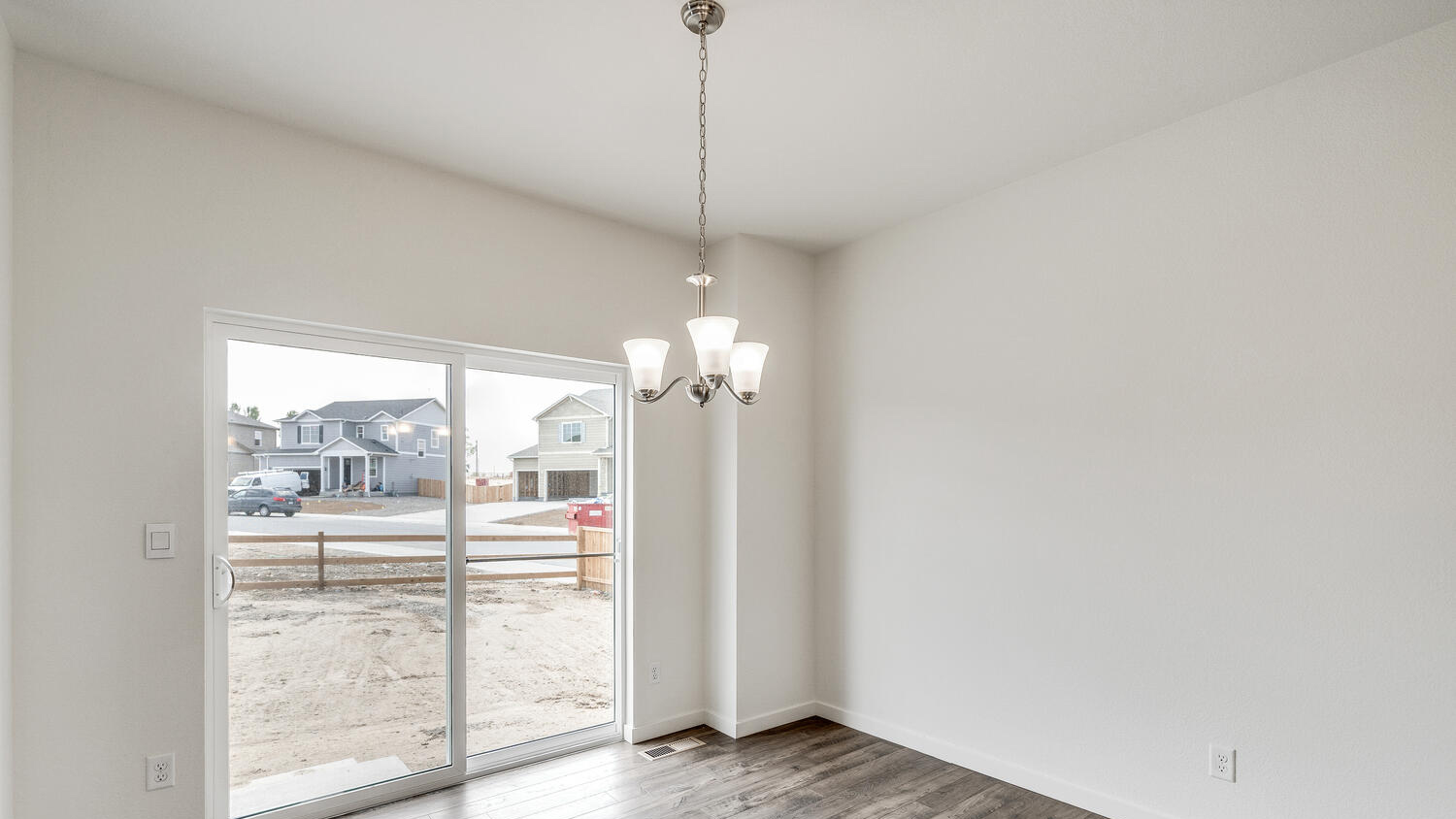 Dining nook with chandelier light fixture and outdoor access through sliding patio door