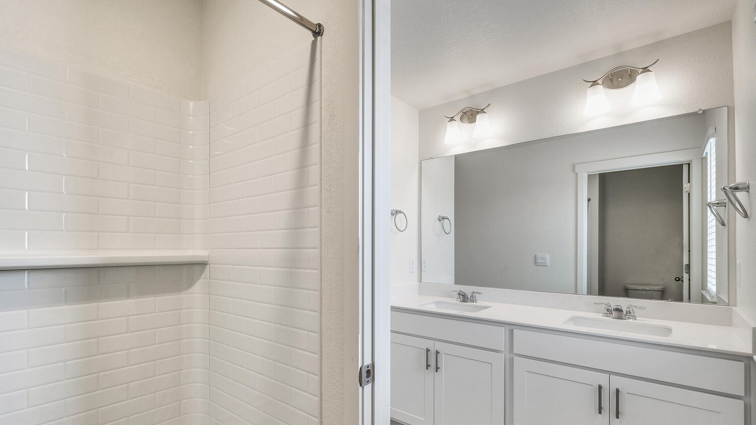 Split secondary bathroom between two secondary bedrooms with dual sinks and separate toilet and shower/tub combo