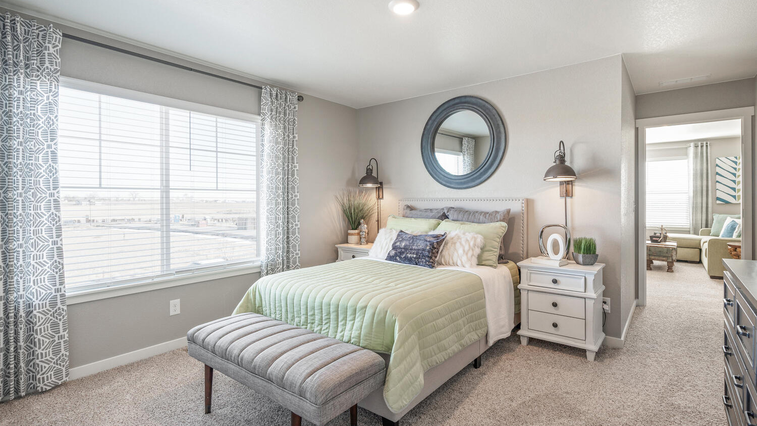 Secondary bedroom with large windows in new D.R. Horton home