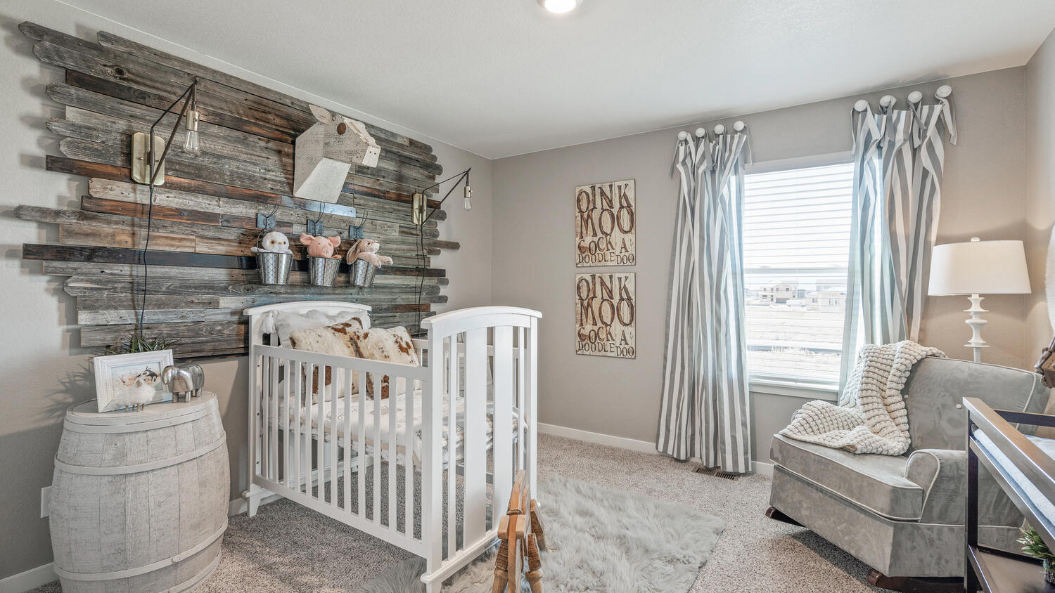 Secondary bedroom flex space with large windows in new home at Commerce City